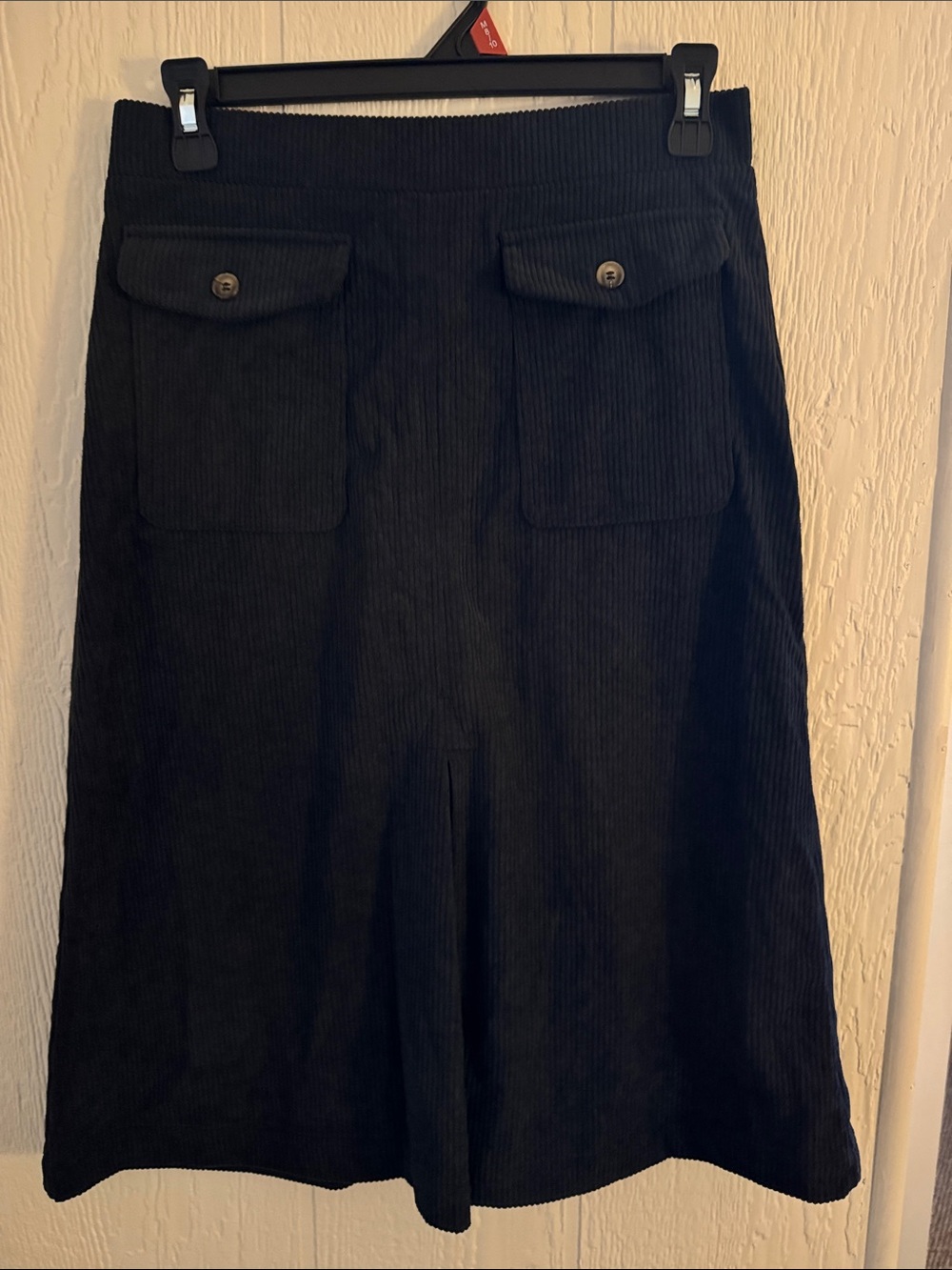 HALARA Black Corduroy A-line skirt with flap pockets